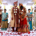indian wedding ceremony red rose petals