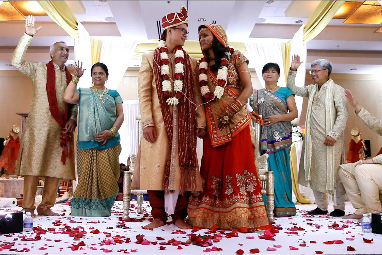 indian wedding ceremony red rose petals